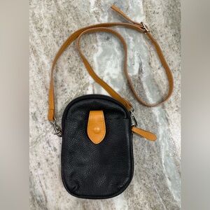 Black Leather Crossbody Bag with Tan Strap and Tab